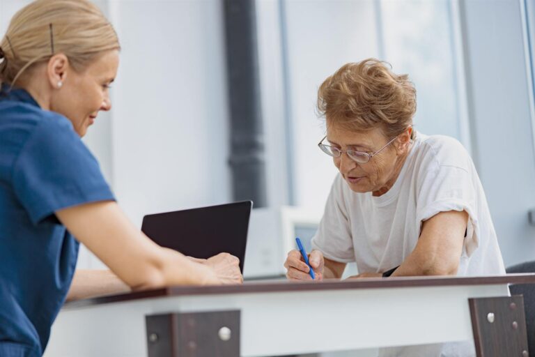 Patient filling in insurance and legal paperwork at a medical clinic appointment