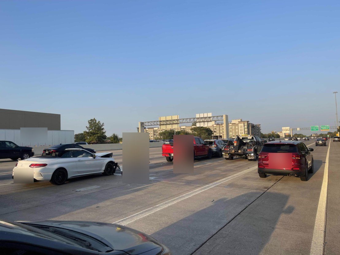 Traffic stopped across several freeway lanes after a chain-reaction collision.