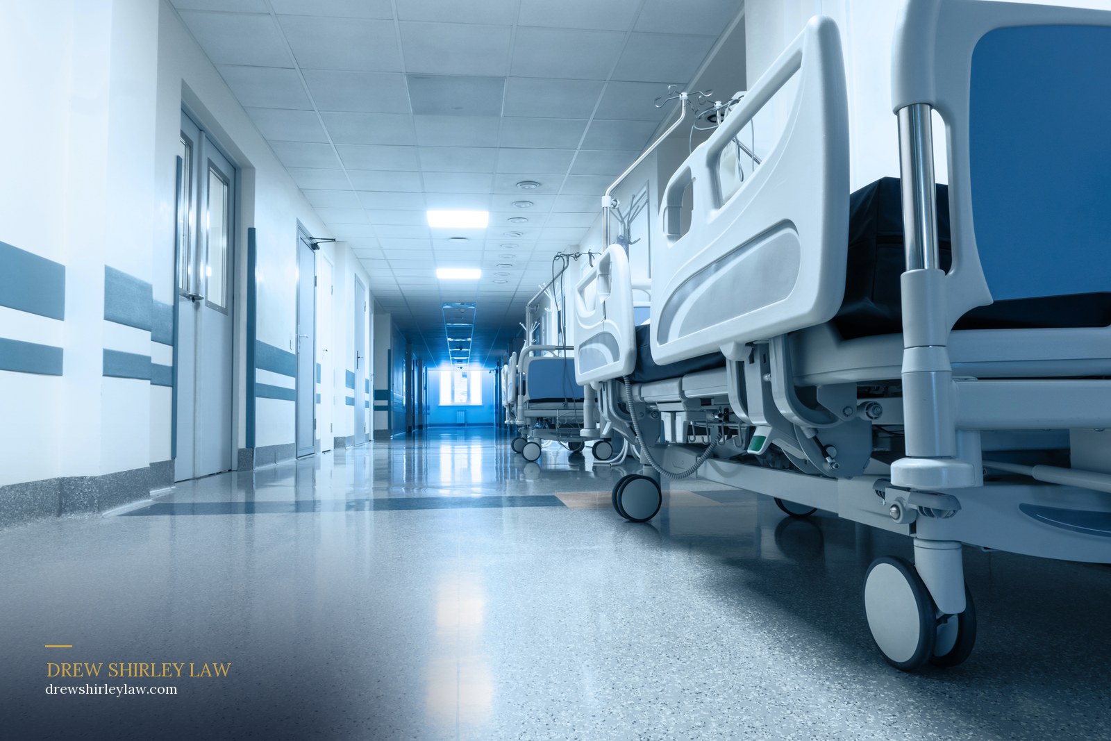 An empty hospital corridor lined with beds, representing the hospitals and health care institutions that can be held responsible in a Texas medical malpractice claim